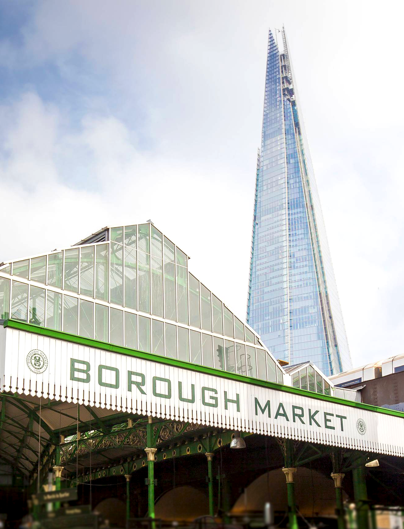 Exterior view of Borough Market, showcasing the vibrant and historic entrance bustling with visitors